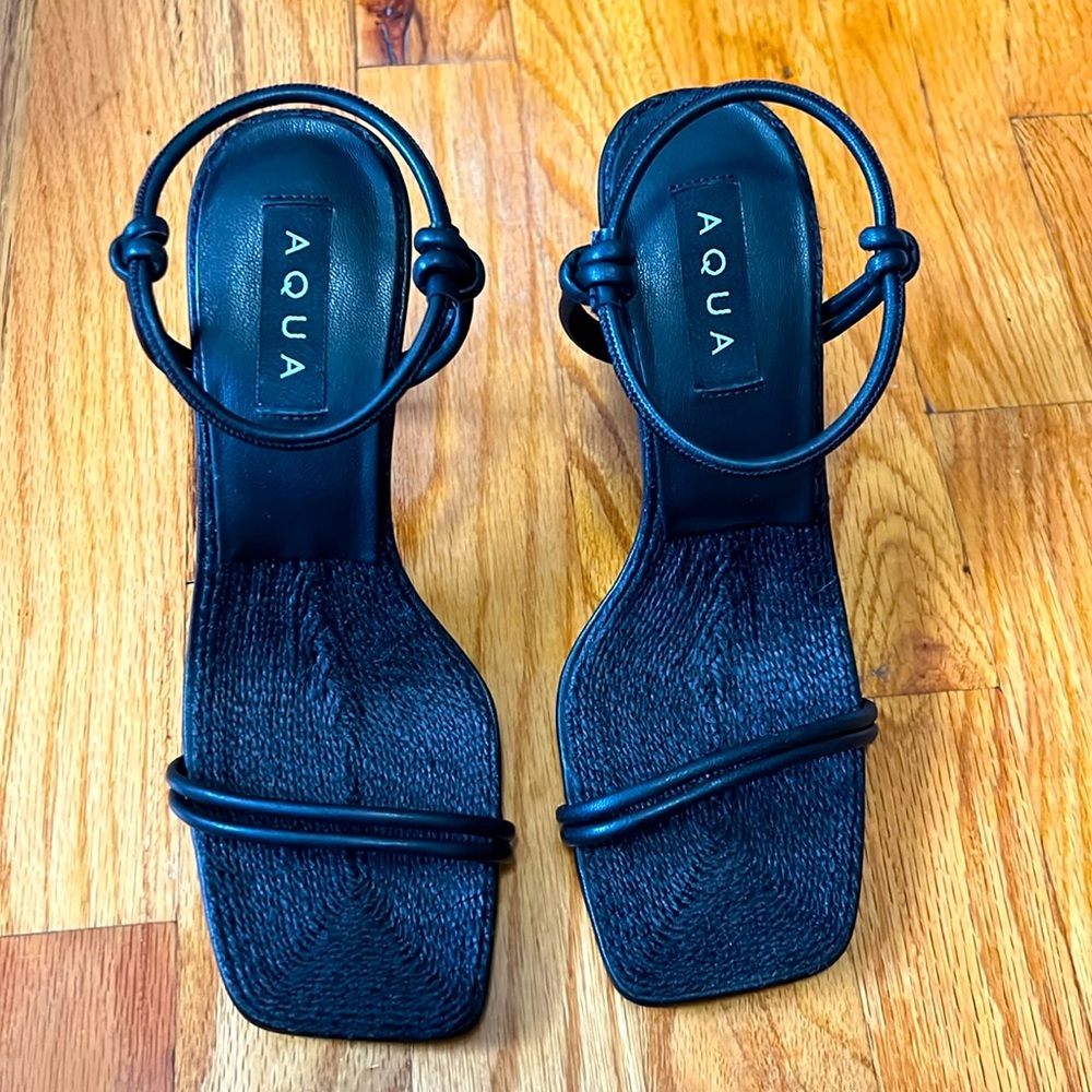 Never worn womens black aqua strappy heels in size 7. Can fit size 7.5